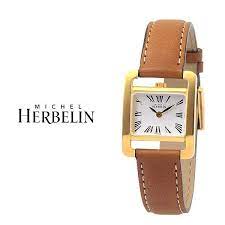 Michel Herbelin horloge " Veme Avenue " zwitsers uurwerk, stalen kast is Pvd geel gecoat, saffierglas en voorzien van een bruine lederen band , model 17037/P01GO - 214716